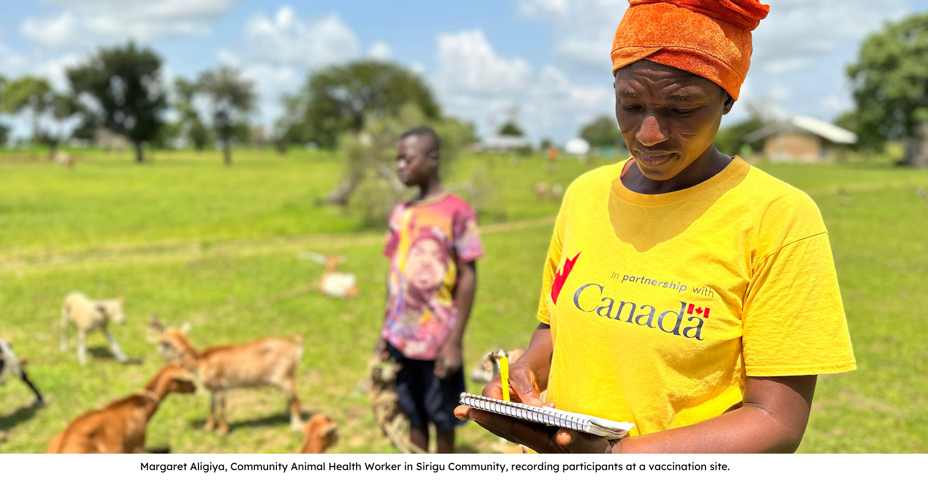 Margaret Aligiya, Community Animal Health Worker in Sirigu Community, recording participants at a vaccination site.